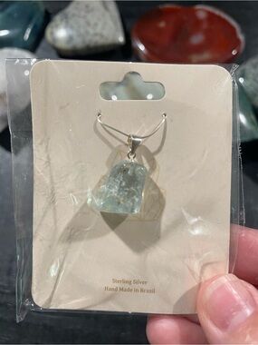 Blue topaz drop style pendant with sterling silver